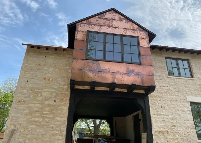 Copper metal panel facade on a stone building for Metal Roof Coating in Addison
